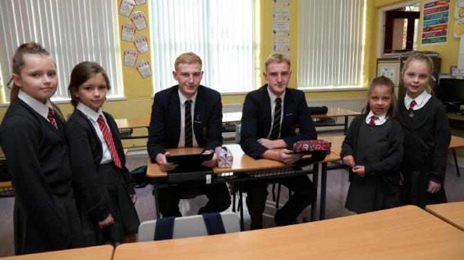 It's a twin thing! Omagh Academy pupils revisit former primary school to welcome new twins at Gillygooley